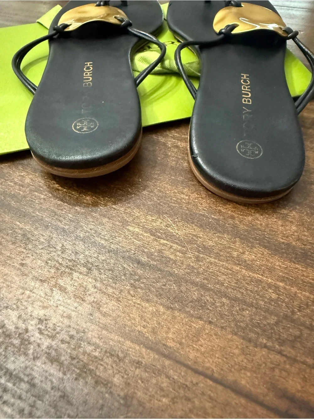 Tory Burch Patos Disk Leather Thong Sandals in black with gold-tone medallions
